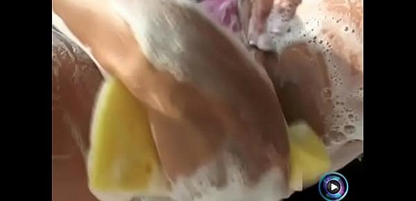  Maria Belucci gets wet and soaped up with her luscious tits and cunt
